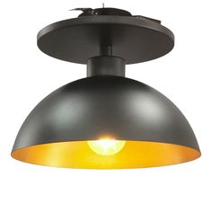 an industrial style light fixture with a yellow light on the bottom and black metal shade