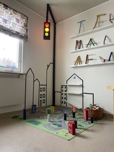 a child's playroom with toys on the floor