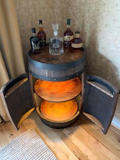 an old barrel with some bottles on it