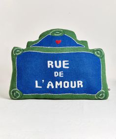 a blue and green sign that says rue de l'amour on the front