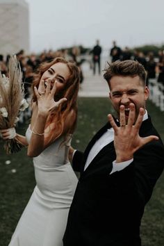 a man and woman standing next to each other in front of an outdoor wedding ceremony