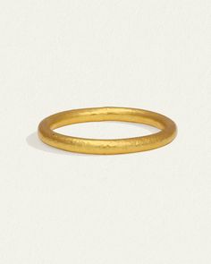 The Tiv Ring is handcrafted from 24k solid gold. Shop minimalist fine jewellery stacking ring with hammered band. Minimalist Hammered Yellow Gold Rings, Gold Hammered Stackable Round Band Rings, Gold Hammered Stackable Rings, Classic Hammered Yellow Gold Stackable Rings, Classic Yellow Gold Hammered Stackable Rings, Classic Yellow Gold Stackable Rings With Hammered Detail, Hammered Yellow Gold Open Midi Rings, Classic Hammered Stackable Round Band Rings, Hammered 22k Yellow Gold Rings