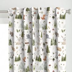 a curtain with animals and trees on it