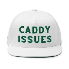 a white hat with the words caddy issues printed on it, and green lettering