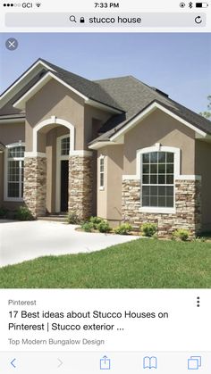 a large house with stone and brick accents