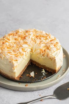 a cake on a plate with one slice cut out