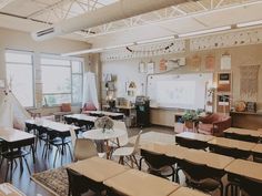 an empty classroom with desks and chairs