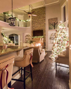 a living room filled with furniture and a christmas tree