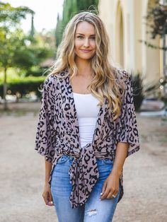 Leopard and more leopard, please! These oh-so-comfy kimonos are sure to become your favorite piece! Available in a few different colors, we're sure you'll find one you love! Try pairing this with jeans, skirts or even dresses to give yourself a whole new look! Size Small 0-4 Medium 6-8 Large 10-12 XL 14-16 Models are 5'5" Size 2/4 wearing small. Bohemian Leopard Print Top For Spring, Bohemian Leopard Print Spring Tops, Spring Bohemian Leopard Print Tops, Leopard Kimono, Maxi Skirt Dress, Early Spring Outfits, Graphic Apparel, Current Fashion Trends, Petite Outfits