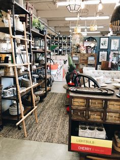 a room filled with lots of furniture and shelves