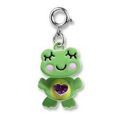 a keychain with a green frog holding a purple heart on it's chest