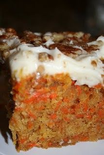 a piece of carrot cake on a white plate