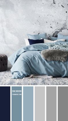 a bedroom with blue and grey colors in the walls, bed linens and pillows