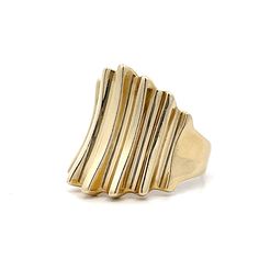 Get ready to make a statement with this stunning modern cocktail ring! Crafted in 14 karat yellow gold, this ring features a sleek, high polished finish that catches the light with every movement. The ridged gold band tapers in size from the center of the ring, creating a unique and eye-pleasing design. Whether you're dressing up for a night out or adding some flair to your everyday look, this ring is the perfect accessory. Its modern design and timeless elegance make it a must-have addition to Modern Cocktail, Gold Band, Cocktail Ring, Cocktail Rings, Gold Bands, Everyday Look, Timeless Elegance, Modern Design, Sleek