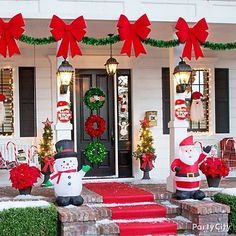 christmas decorations on the front porch of a house