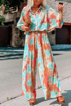 Details: Material: Polyester. Spandex Style: Bohemian Pattern Type: Tie Dye Element: Patchwork Neckline: Turndown Collar Sleeve Style: Regular Sleeve Sleeve Length: Half Sleeve Fit Type: Loose Profile: Wide Leg Type: Full Print Size(in) Bust Bottom Length S 41.3 51.2 M 43.3 51.6 L 45.3 52 XL 47.2 52.4 Tips:Due to the many variations in monitors. the color in the image could look slightly different. please take physical design and color shall prevail.Please allow 0.4"-1" differs due to manual mea Outfits Bright Colors, Shirt Collar Styles, Loose Jumpsuit, Flowy Fabric, Pleated Shirt, Bohemian Pattern, Jumpsuits And Romper, Tie Dye Designs