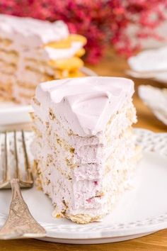 a piece of cake sitting on top of a white plate next to a silver fork