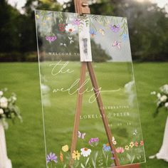 an easel with flowers painted on it