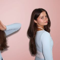 the woman is brushing her long hair