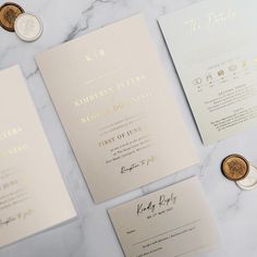 wedding stationery and money laid out on a marble table