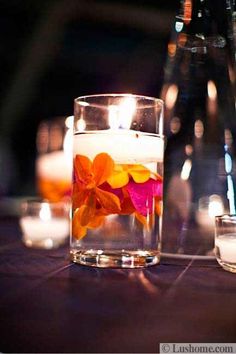 30 Ideas for Summer Decorating with Beautiful Flowers and Candles Centerpieces Flowers And Candles Centerpieces, Candles Centerpieces, Floating Petals, Full Bouquet, Candle Flower, Flowers And Candles, Flowers Candles, Short Glass, Party Table Centerpieces