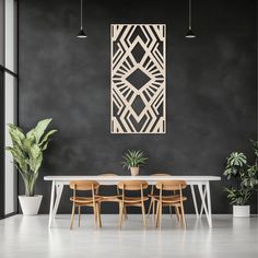 a dining room table with four chairs and a plant