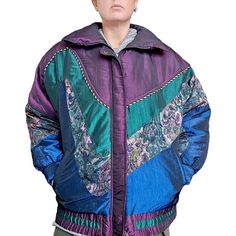 "Embrace vintage style with this 80s women's medium puffer coat, featuring a retro floral tapestry design in shades of Irridescent purple, blue, and emerald green. The cozy coat is perfect for winter sports or casual wear, with a bomber-style silhouette and ski-inspired details.  Crafted from high-quality materials, this pre-owned piece is sure to make a statement in your wardrobe. The coat is labeled as 'medium' but please refer to the provided measurements for accurate sizing. Don't miss out on the chance to add this unique, one-of-a-kind piece to your collection. Fits modern medium Clean and flaw free Pockets Metal tassle zipper pull Approximate measurements laid flat  Chest 25\" Length 27\" Clean and flaw free" 80s Women, Cozy Coats, Floral Tapestry, Casual Coat, Retro Floral, Tapestry Design, Winter Sports, Puffer Coat, Coats Jackets Women