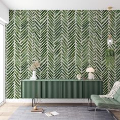 a living room with green and white wallpaper