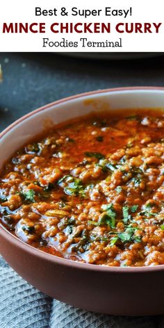 the best and super easy mince chicken curry in a brown bowl on a blue towel