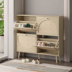 a wooden cabinet with baskets and shoes on it