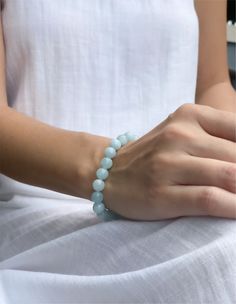 Asana Crystals introduces a genuine Aquamarine Beaded Bracelet handcrafted with love. Since ancient times aquamarine was used as a symbol of protection and fearlessness. The Greeks believed it provided a safe passage across stormy seas. You can wear the aquamarine beaded bracelet to benefit from its healing properties. All of our beaded bracelets are handmade with natural 8mm gemstone beads and come in a beautiful gift box. Explore our collection of energy bracelets at www.crystal-shop.co. Aquamarine Crystal Bracelet, Aquamarine Beaded Bracelet, Aquamarine Bracelet Beads, Ocean Blue Color, Stormy Seas, The Greeks, Aquamarine Bracelet, Valentines Sale, Energy Bracelets