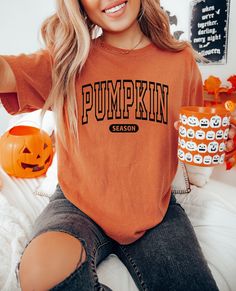 This cozy Comfort Colors tee is the perfect gift for a lady ( or for yourself of course)!  Featuring the saying "Pumpkin season" in bold letters on the front, this shirt is stylish and cute fall wear. For the kids shirt: https://www.etsy.com/listing/1559993991/pumpkin-season-shirt-for-girls-kids?click_key=d07477a03db3f0f288d7bcc666fc59e468e34351%3A1559993991&click_sum=d952a7f8&ref=shop_home_active_19&pro=1&sts=1 𝐇𝐎𝐖 𝐓𝐎 𝐎𝐑𝐃𝐄𝐑 1. Select the size & color when applicable 2. Add the persona Fall Graphic Tees Trendy, Fall Svgs For Shirts, Fall Diy Shirts, Orange Crew Neck Top For Fans, Diy Fall Shirts Vinyl, Funny Text Crew Neck T-shirt For College, Trendy Fall College T-shirt, Trendy College T-shirt For Fall, Cute Fall T-shirt With Slogan