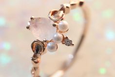 Named after the Roman goddess of love and beauty, Venus comes in rose gold. She features a rainbow moonstone with sapphire and pearl accents. According to Greek mythology, pearls are said to be the tears of Aphrodite, the Greek goddess counterpart of Venus. This Ring is plated in 14Kt rose gold, and with proper care the plating will last between 1 - 2 years. Sapphire And Pearl, Goddess Of Love And Beauty, Aphrodite Aesthetic, Goddess Jewelry, Roman Goddess, Mother Goddess, Goddess Of Love, Greek Goddess, Aphrodite