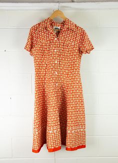 VINTAGE Women's 1960s Fit and Flare Day Dress | Orange Abstract | Unique! Description Australian designed, DOMONY of Sydney, this orange number is slinky and cool, great for Summer! It features buttons from crotch to chest, short sleeves and darts. It does appear that there has been a bit of work done to the seams with some hand sewn alterations/repairs. See pics. Some little holes here and there so it will need a bit of love. Priced accordingly! Material - not labelled Brand - Domony Sydney Siz Retro Dress With Orange Retro Print, Orange Retro Dress With Retro Print, Orange Dress With Retro Print, Orange Retro Print Summer Dress, Orange Mod Dress With Retro Print, Mod Orange Dress With Retro Print, Vintage Summer Dress With Retro Print, Retro Orange Summer Dress, Vintage Orange Summer Dress