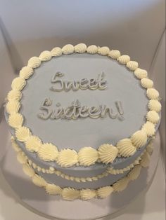 a frosted cake with the words sweet sixteen on it's top and bottom