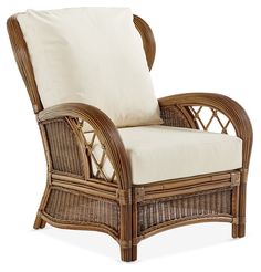 a wicker chair with a white cushion