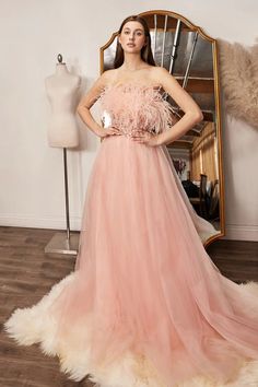 This gorgeous ladivine dress features luxurious long blush tulle fabric and sequin embroidery for an eye-catching look. Its A-line design and strapless silhouette offer a flattering fit for any special occasion. Lightweight and comfortable, the feather trim adds an elegant finish to this show-stopping gown. Size: 4 Color: Blush Off Shoulder Wedding Dress, Cinderella Divine, Prom Ball Gown, Formal Dresses For Weddings, Feather Dress, Gown Dress, Layered Skirt, Long Prom Dress, Homecoming Dress