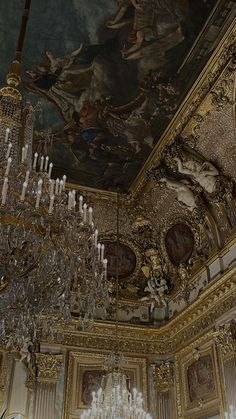 a chandelier hanging from the ceiling in a fancy room