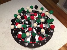 a close up of a clock made out of lollipops