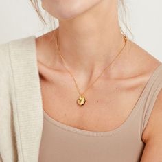 Simplicity shines with the layered hammered details of organically shaped discs in the Maua Delicate Necklace. This necklace is sure to be a special staple, whether worn solo or as a layering piece. Handcrafted by our artisans in Kenya using traditional techniques. Handcrafted in brass by artisans in Kenya. Gold products are 24k gold plated brass and match our brass style in color and tone. Your purchase promotes artisan innovation + entrepreneurship. To learn more about keeping your jewelry shi Innovation And Entrepreneurship, Delicate Gold Necklace, Tarnish Remover, Chain Links, Delicate Chain, Delicate Necklace, Selling Jewelry, Gold Plated Silver, Link Necklace