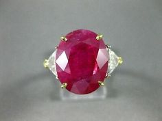 an oval shaped ruby and diamond ring