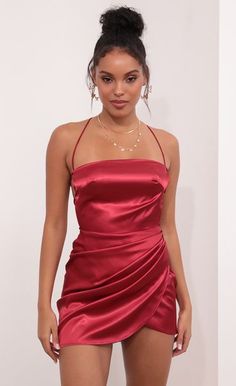 This stunning satin dress is a real show-stopper. This piece features a classy square neckline, side pleat detailing and lace-back for an adjustable fit. Pair with a nude lip, crystal earrings and high heels and you'll steal the show all night long!

	 

	 

	Made In Los Angeles

	 

	- 100% Polyester

	 

	-Tie Back Detailing

	 

	-Lining Included

	 

	-Zipper Closure

	 

	- Hand Wash Cold

	 

	 

	Length of Dress Measures 31in/78.7cm Mini Satin Dress, Homecoming Dresses Lace, Red Strapless Dress, Satin Homecoming Dress, Silk Satin Dress, Champagne Dress, Nude Lip, Open Back Dresses, Satin Mini Dress