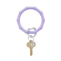 a purple keychain with the word pre - order in the cabana on it