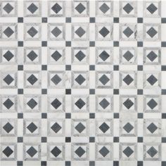 a black and white tiled wall with squares