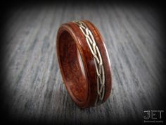 "Welcome yo my JET Bentwood jewelry shop! This listing is for a Bolivian Rosewood ring with Woven German Silver Wire Inlay. You are in Charge to customize this ring to your Taste including the type of wood and inlay materials you want to use making it more personal to you.  Brilliant eye caching Bolivian rosewood ring with an attractive hand braided German silver wire inlay. -Pictured ring is 6 mm (1/4\") wide -I am using the highest quality wood to hand make all my rings to your order, you are Handmade Brown Ring For Wedding, Wooden Wedding Ring, Bentwood Rings, Ring Storage, German Silver, Wooden Rings, Womens Wedding Bands, Wood Jewellery, Ring Silver