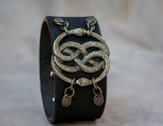 Neverending Story Auryn Bracelet Leather Cuff - Geekify IncGeekify Inc Neverending Story, Bracelet Leather, Leather Cuffs, Handmade Leather, Leather Handmade, Leather Bracelet, Gold Bracelet, Geek Stuff, Cuff