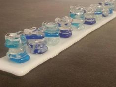 a row of baby pacifiers sitting on top of a table