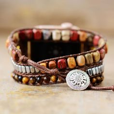 Showcase your style with this luxurious Boho Multilayer Wraps IWatch Strap, made with premium tiger eye, jasper and crystal beads. Its brown tones exude elegance and sophistication, making it the perfect accessory for your sophisticated look. Material: Jasper, Metal Beads, Crystal, Tiger Eye. 3 sizes: The length of watchband have 3 sizes: S-48cm/M-53cm/L-56cm. Fit for: Apple Watch series 8 7 6 5 4 3 2 SE. Band fits 5.3-7 inches wrist, compatible with 38mm-45mm apple watch face, easy to install, Brown Bohemian Rectangular Bracelet, Bohemian Brown Rectangular Bracelet, Brown Rectangular Bohemian Bracelet, Brown Rectangular Jewelry, Luxury Brown Jewelry With Natural Stones, Adjustable Brown Beaded Bracelet With Gemstone Beads, Adjustable Brown Gemstone Beaded Bracelets, Bohemian Brown Rectangular Jewelry, Brown Agate Beaded Bracelet With Polished Beads