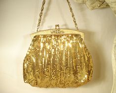 "I was SO excited when I found this purse Offering an exquisite vintage 1940s era gold mesh Art Deco flapper purse made by Whiting & Davis in near PRISTINE vintage condition and perfect for the Bride! If you've ever seen one of these purses in person you know just how well made they are. The mesh has a wonderful fluidity and movement so it shimmers as it catches the light. I love the SO 1920s Art Deco flapper design of this one. The frame is textured gold with a stunning raised filigree piec Retro Gold Bags For Events, Retro Gold Bag For Events, Gold Vintage Bag For Events, Retro Gold Evening Bag, Antique Gold Bag For Vintage Events, Victorian Gold Bag For Party, Gold Antique Bag For Vintage Events, Vintage Evening Bag For Vintage Events, Antique Gold Bags For Vintage Events