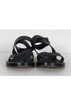 Chic sandals in black leather with an ankle strap design. Perfect for casual wear, style them with any dress or skirt. Size 6 - EU 36 Leather upper & sole Ankle strap design Silver-tone buckle Tan brown & silver trim Some wear on sole Light marks on leather Light creasing on leather Outsole length 9.5" Chic Sandals, Brown Silver, Strap Design, Design Silver, Stylish Shoes, Ankle Strap Sandals, Strap Sandals, Tan Brown, Ankle Strap